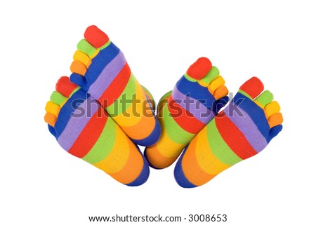 Man and woman feet in funny socks touching (isolated) - concept for compatible soulmates, togetherness and fun