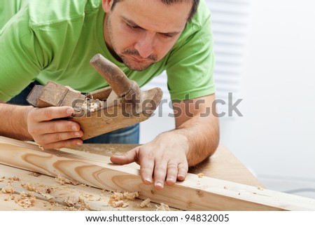 Man working with wood and traditional tools