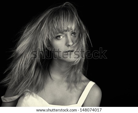 Beautiful Image of a Blond woman On Black in studio in Black and White