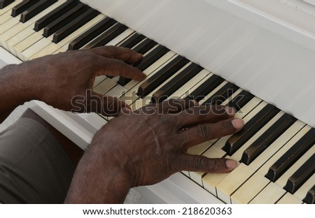 Nice Image of a afro american senior Playing piano