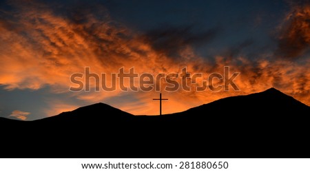 Beautiful Silhouette Image of a cross on top of a Mountain on the mexican border