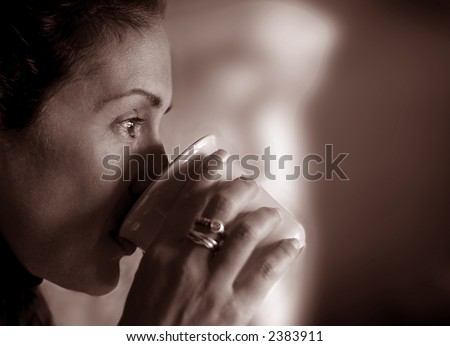 Woman Drinking coffee and Contemplating her life