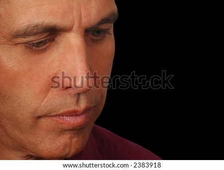 Closeup of a salesman pondering what his life is about