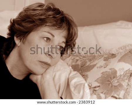 Woman in bed home from work on Sick Day