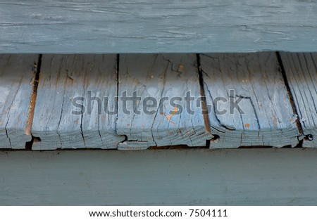 Close up image of a painted vintage front porch