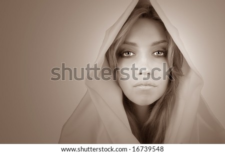 Beautiful Blond woman with white cape isolated