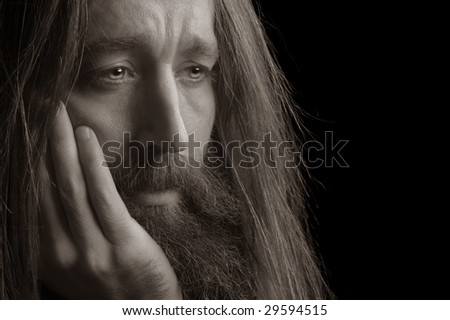 Nice portrait Image of a Long Haired Man On Black