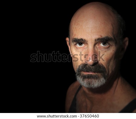 Nice color Image of a Balding Older Man On Black
