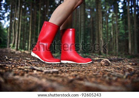 Girl in Red Rain Boots in the Forest