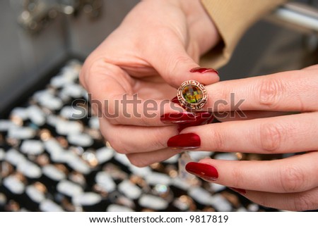 A woman tries on ring