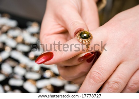 A woman tries on ring