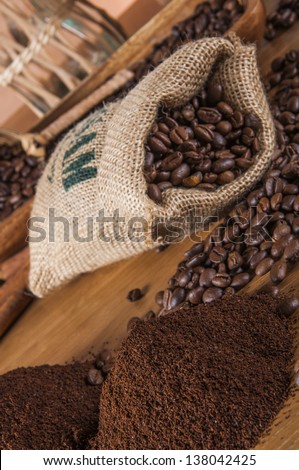 Coffee beans, wooden table with ambient light