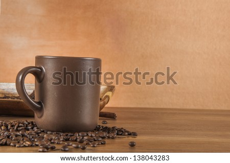 Coffee theme with wooden table and dark background