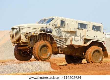 PRETORIA, SOUTH AFRICA -SEPT. 19: A  mine-resistant vehicle from DCD in action during the African Aerospace & Defence show on Sept. 19, 2012 at AFB Waterkloof in Pretoria.