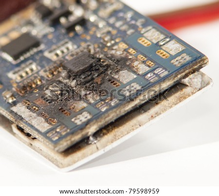 Failed Electronic surface mount components on a blue circuit board