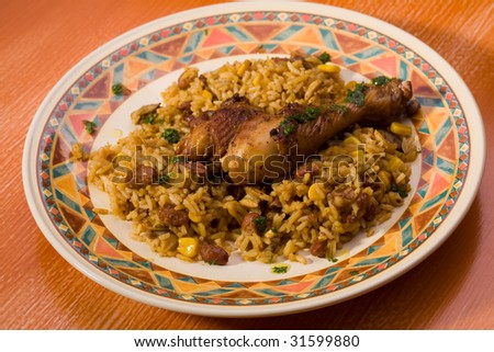 Delicious chicken with rice and beans, studio shot