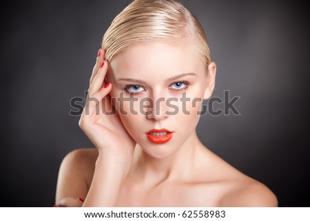 Girl with blue eyes and red lips, close up shot