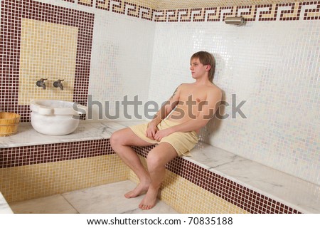 Man in turkish sauna relaxing, indoor shot