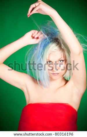 Cutting hair crazy caucasian girl, vertical shot