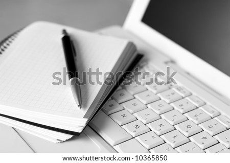 Shallow depth of field, focus on the tip of the pen and the area nears it