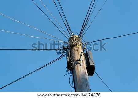 An UK telegraph pole with complicated wiring