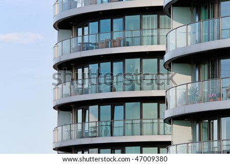 Photo of a luxury apartment building in London against a blue sky