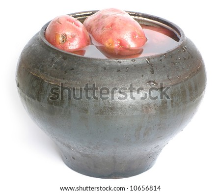 Cast iron pot with potatoes, world cuisine.