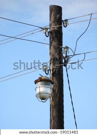 lamp on a wooden pole and wires