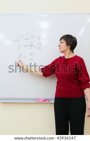 school teacher at the whiteboard