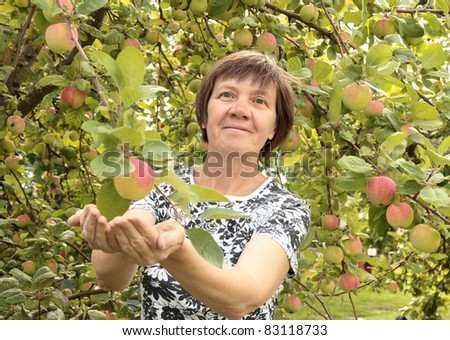 middle-aged woman in the garden,joy to the soul.