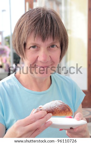 Middle-aged woman in a cafe, Baltic countries