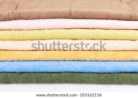 seven new dry towels on white background
