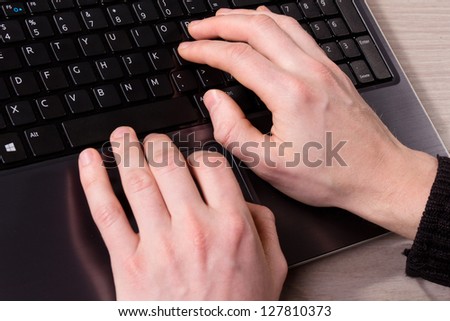 human  hands on the keyboard of computer