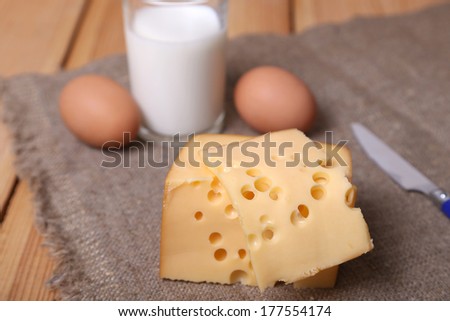 piece of fresh cheese with eggs, milk