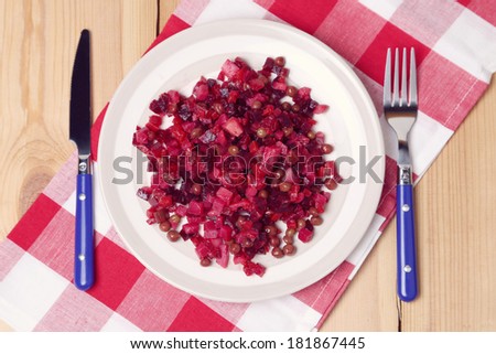 vinaigrette with a beet, cucumbers, potato in a dish