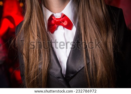 new red bow tie on adult woman indoor