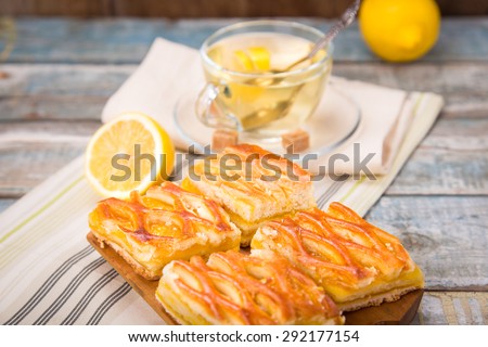 fresh lemon pie with tea,lemon fruits on wooden plate