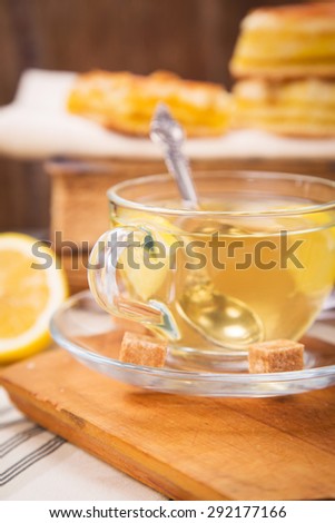 fresh lemon pie with tea,lemon fruits on old book