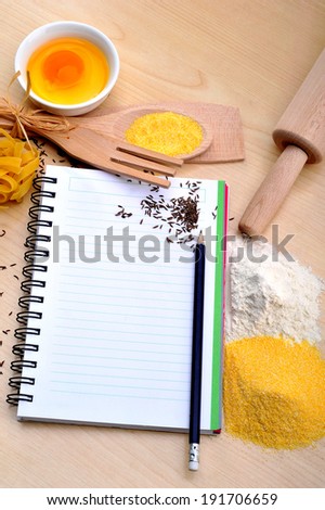 blank recipe book with bread, egg, flour, corn flour, cumin