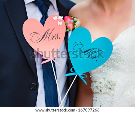 Couple show hearts card with text MR and MRS