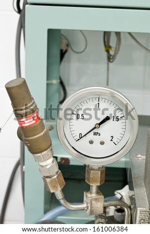 Pressure release valve and pressure gage on reactor equipment