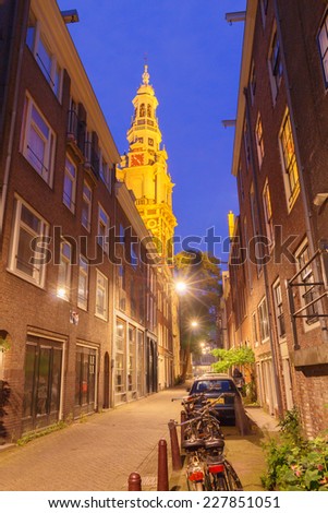 Amsterdam, Netherlands - July 31, 2014: Narrow street of traditional Amsterdam at night.