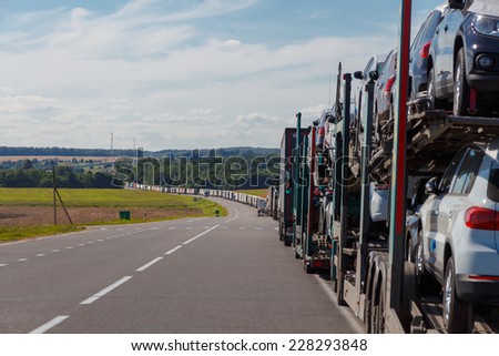Belarus, Stone Log - July 18, 2014: Automotive queue of heavy vehicles on the road before crossing the border with the European.