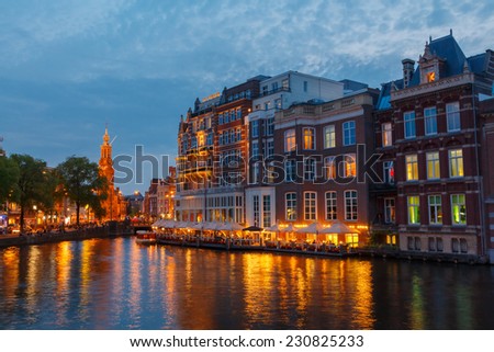 Amsterdam, Netherlands - July 31, 2014: Canals of Amsterdam. Favorite place for walking and leisure travelers.