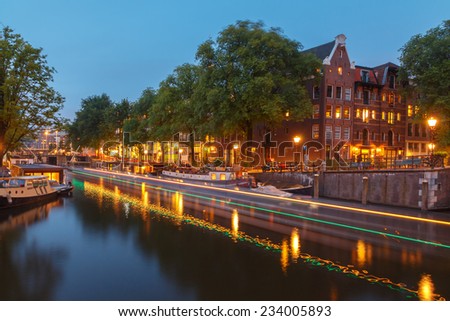 Amsterdam, Netherlands - August 6, 2014: Canals of Amsterdam. Favorite place for walking and leisure travelers.