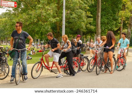 Amsterdam, Netherlands - August 5, 2014:  Cyclists on the cycling road Vondelpark in Amsterdam.