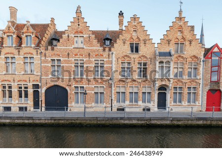 Traditional Belgian facades of houses on the canal Spiegel Rei in the city of Bruges.