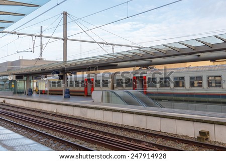 Bruges, Belgium - December 29, 2014: Passenger train near the platform of the railway station in the city of Bruges.