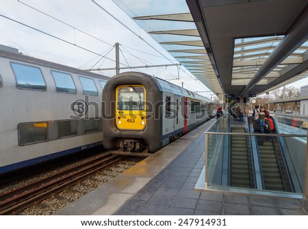 Bruges, Belgium - December 29, 2014: Passenger train near the platform of the railway station in the city of Bruges.