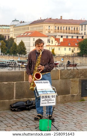 Prague, Czech Republic - October 1, 2014: presentation by of street musicians on the Charles Bridge. Charles Bridge is one of the most famous sights of the Czech capital.